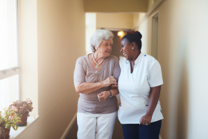 A caregiver and a patient talking