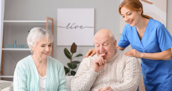 A happy couple elderly and Caregiver