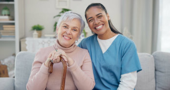 A happy elderly and Caregiver